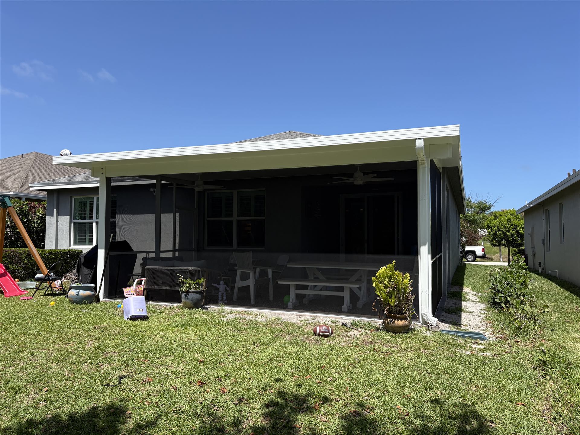 Screened lanai enclosure on a single-story home