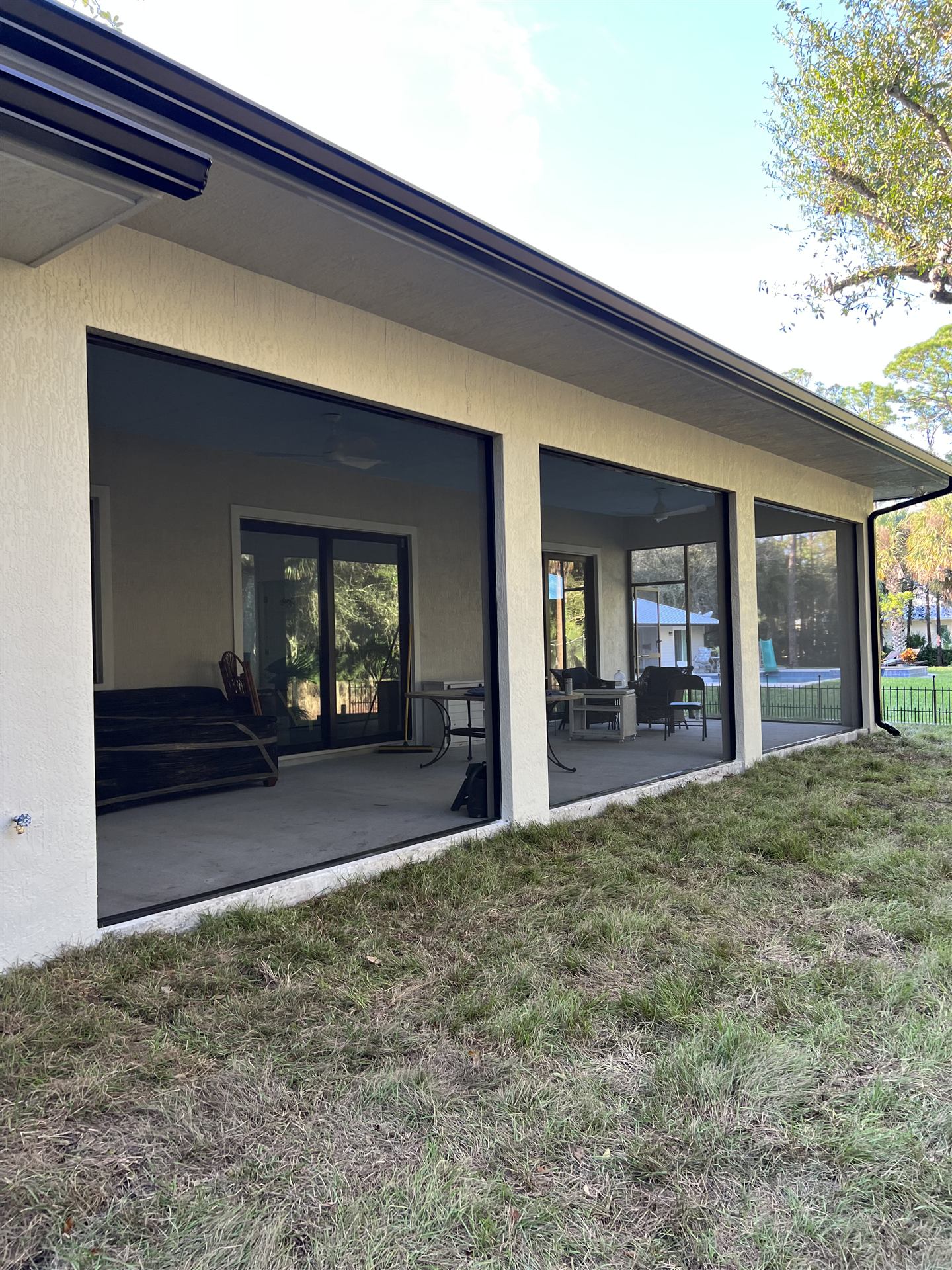 Long panoramic view along a screened patio
