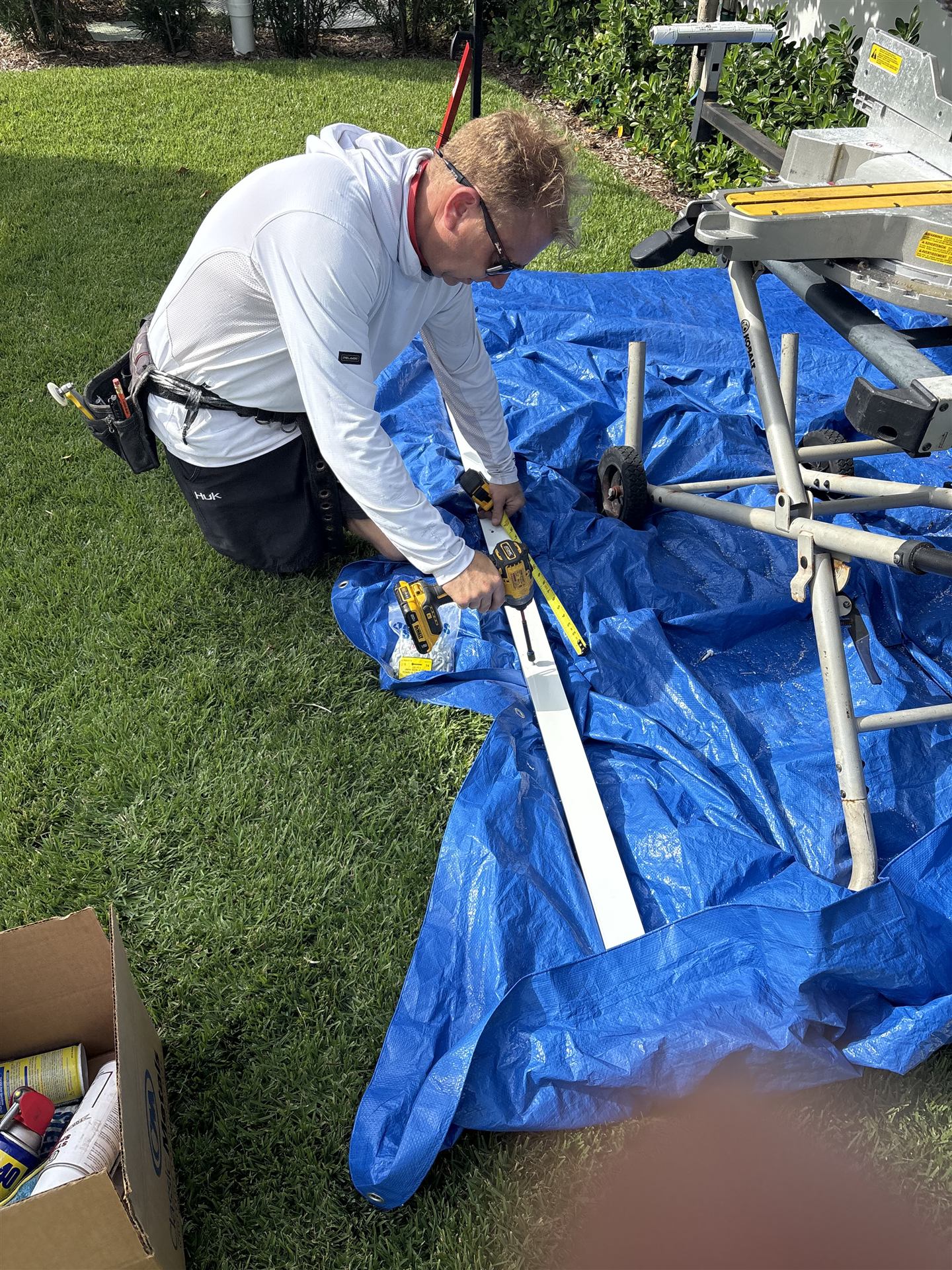 Big Al's Aluminum crew member measuring aluminum framing on-site